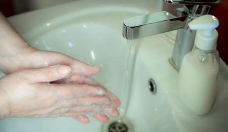 Prevention of coronavirus-destruction of pathogenic bacteria. Wash your hands with liquid soapの写真素材
