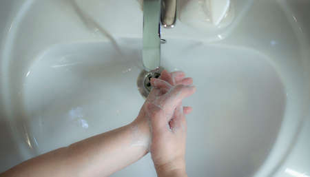 Prevention of coronavirus-destruction of pathogenic bacteria. Wash your hands with liquid soapの写真素材