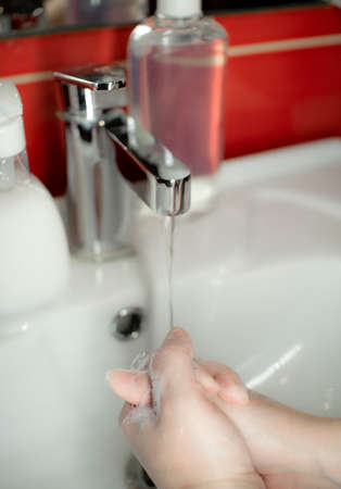 Prevention of coronavirus-destruction of pathogenic bacteria. Wash your hands with liquid soapの写真素材
