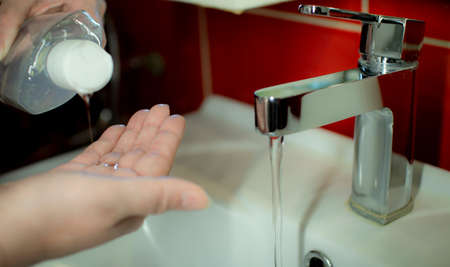 Prevention of coronavirus-destruction of pathogenic bacteria. Wash your hands with liquid soapの写真素材
