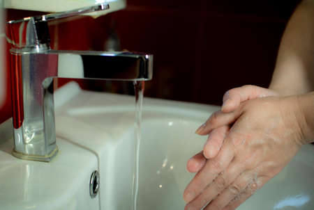 Prevention of coronavirus-destruction of pathogenic bacteria. Wash your hands with liquid soapの写真素材