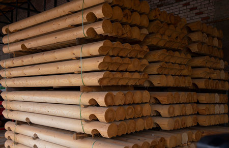 Round logs at the sawmill.Stacks of round logs for building a wooden house. Woodworking factory.の写真素材