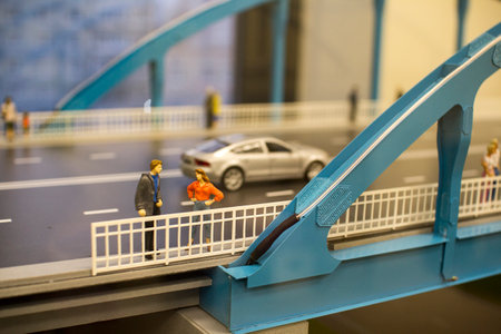 Miniature toy cars and people on the bridgeのeditorial素材
