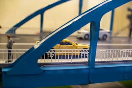 Miniature toy cars and people on the bridgeのeditorial素材