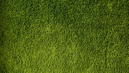 Green background made of artificial threads. Green fabric texture and pattern for background.の写真素材