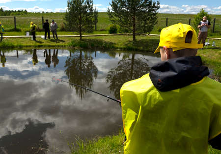 Fishing competitions among children. Fishermans Day at a fishing farm on July 14, 2020 in Ustye, Russia.のeditorial素材