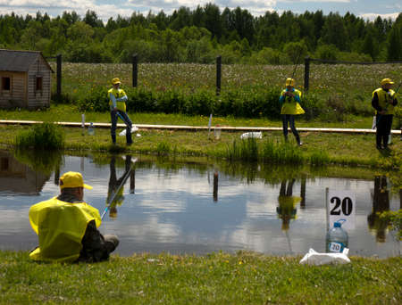 Fishing competitions among children. Fishermans Day at a fishing farm on July 14, 2020 in Ustye, Russia.のeditorial素材