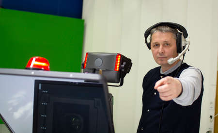 Professional cameraman working in a TV Studio.の写真素材