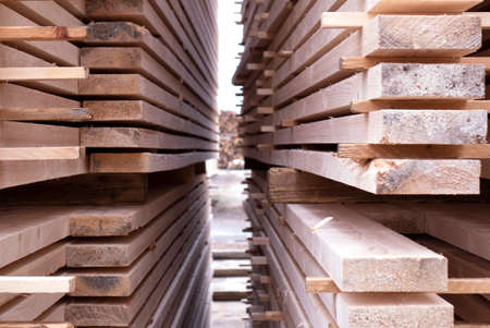 Lumber warehouse. Wooden boards in a stack