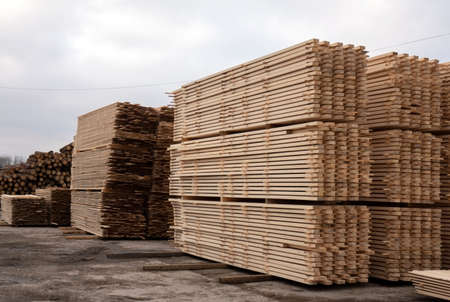 Lumber warehouse. Wooden boards in a stackの写真素材