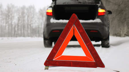 An emergency stop sign.Winter time.の写真素材