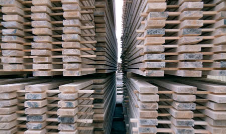Lumber warehouse. Wooden boards in a stack