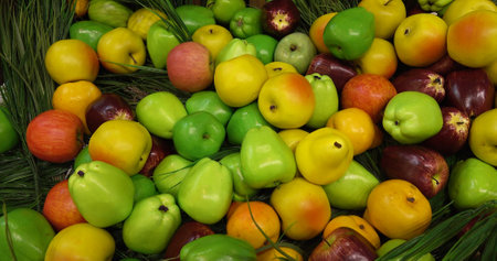 Apples and pears. A vivid close-up of colorful fruits. Ideal for the concept of a healthy lifestyleの写真素材