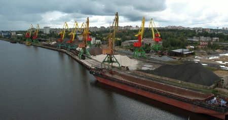 The ship is in port. Lots of tall cargo cranes for unloading ships.の写真素材