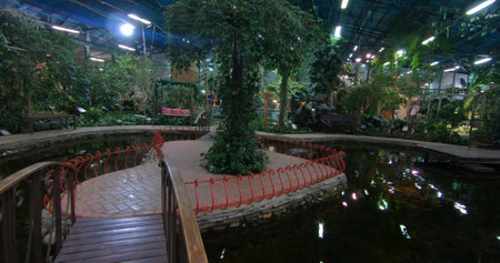 A luxurious and stunning oasis with a pond and lush garden. A space for entertainment and relaxation.の写真素材