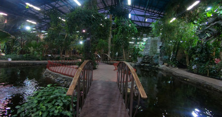 A luxurious and stunning oasis with a pond and lush garden. A space for entertainment and relaxation.の写真素材