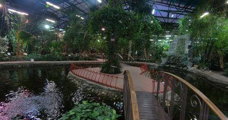 A luxurious and stunning oasis with a pond and lush garden. A space for entertainment and relaxation.の写真素材