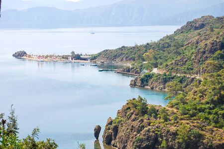View on bay of Aegean Sea with rocky shoreの写真素材