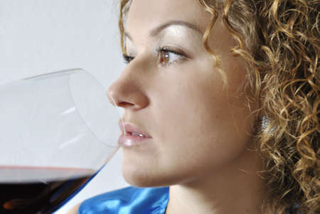 Young womern with glass of wineの写真素材