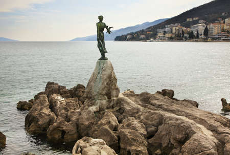 Maiden with seagull in Opatija. Croatiaの写真素材