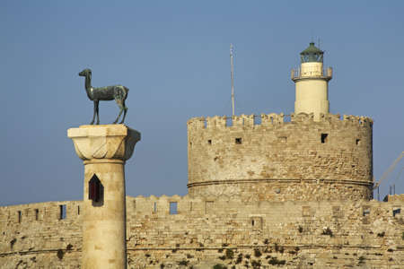 Bronze deer and Fort of St. Nicholas in Rhodes city. Rhodes island. Greeceのeditorial素材