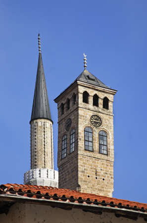 Sahat-kula (clock tower) and mosque in Sarajevo. Bosnia and Herzegovinaの写真素材