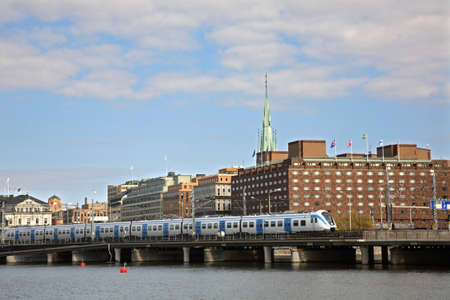 Train on bridge in Stockholm. Swedenのeditorial素材
