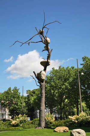 Sculpture of tree with stones at park of Rijksmuseum - Dutch national museum in Amsterdam. Netherlandsのeditorial素材