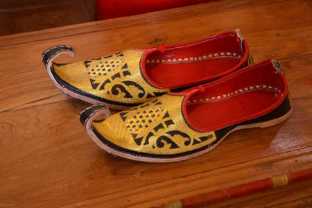 Curved mojri at Sangolda interior shop in Sangolda village. Bardez sub-district. North Goa. Indiaのeditorial素材