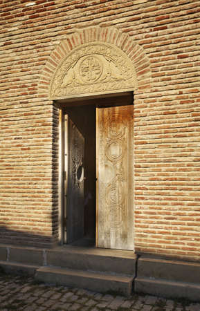 The entrance door of a church in Sighnaghi.の写真素材