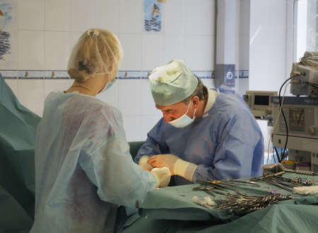 Doctors perform surgery in hospital.のeditorial素材