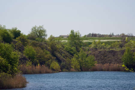 deep lake near rocks and treeの写真素材