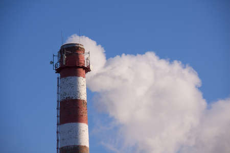 toxic chimney with white fogの写真素材