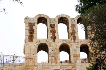 ncient theatre of Herodes Atticus is a small building of ancient Greece used for public performances of music and poetry, below on the Acropolis and in background dwelling of metropolis Athensの写真素材