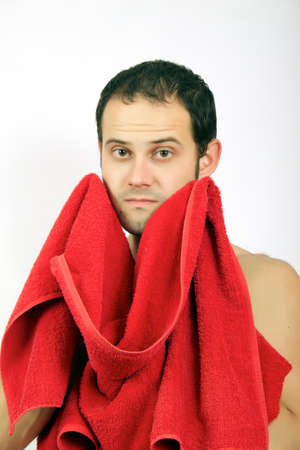 Beautiful muscular man with the towel on the white backgroundの写真素材