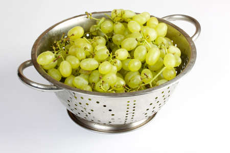bunch of fresh grapes isolated on whiteの写真素材