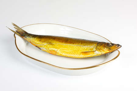 Smoked herring isolated on a white backgroundの写真素材