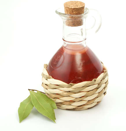 vinegar bottle and laurel leaf on the whiteの写真素材