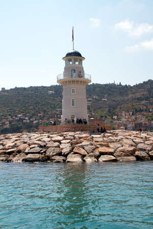 Lighthouse in port. Turkey, Alanya. Sunny weatherの写真素材