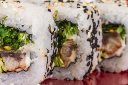Japanese traditional Cuisine - Maki Roll with Nori , Cream Cheese and Eel. Isolated over white backgroundの写真素材
