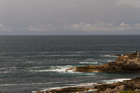 The waves fighting about deserted rocky coast of Atlantic ocean, Portugalの写真素材