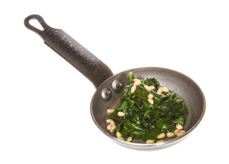 Boiled spinach on roasted panの写真素材