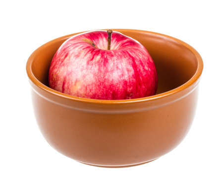 fresh red apples in the dish isolated on white backgroundの写真素材