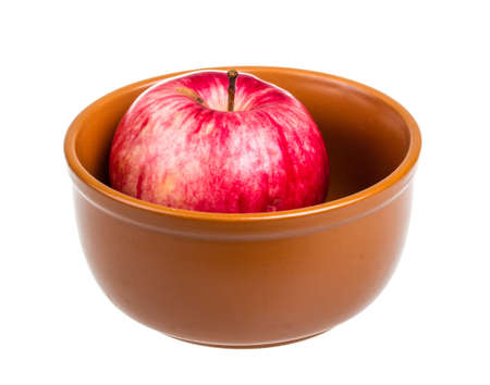 fresh red apples in the dish isolated on white backgroundの写真素材