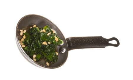 Boiled spinach on roasted panの写真素材