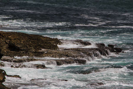 The waves fighting about deserted rocky coast of Atlantic ocean, Portugal