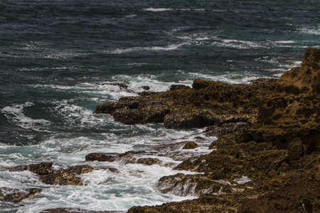 The waves fighting about deserted rocky coast of Atlantic ocean, Portugal