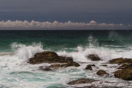 The waves fighting about deserted rocky coast of Atlantic ocean, Portugalの写真素材