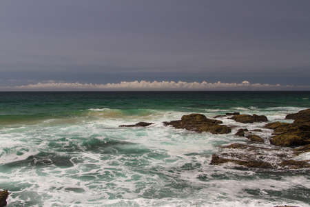 The waves fighting about deserted rocky coast of Atlantic ocean, Portugalの写真素材