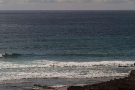 The waves fighting about deserted rocky coast of Atlantic ocean, Portugal